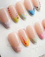 Candy Dot short almond press-on nails with pastel French tips and polka dots