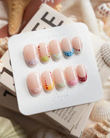 Candy Dot short oval press-on nails with glossy candy-color polka dots