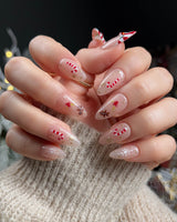 Candy Holiday press-on nails — Festive Christmas, Candy Canes & Gingerbread Man. handmade nail art by Joyee Nails