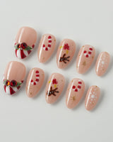 Candy Holiday press-on nails in extra short almond shape — Festive Christmas, Candy Canes & Gingerbread Man.
