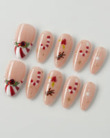 Candy Holiday press-on nails in medium almond shape — Festive Christmas, Candy Canes & Gingerbread Man.