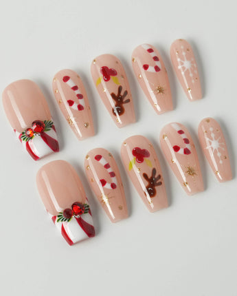 Candy Holiday press-on nails in medium coffin shape — Festive Christmas, Candy Canes & Gingerbread Man.