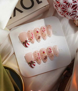 Candy Holiday handmade press-on nails featuring Festive Christmas, Candy Canes & Gingerbread Man.