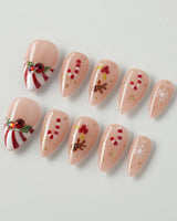 Candy Holiday press-on nails in short stiletto shape — Festive Christmas, Candy Canes & Gingerbread Man.