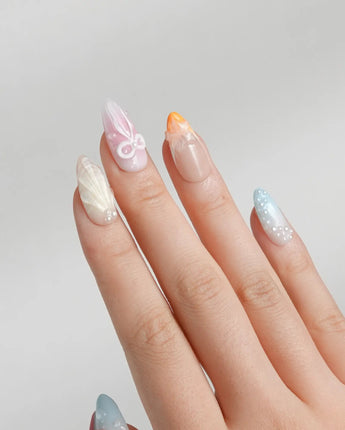 Candy Shore medium almond nails with coral stars, pastel seashells, and glossy gel