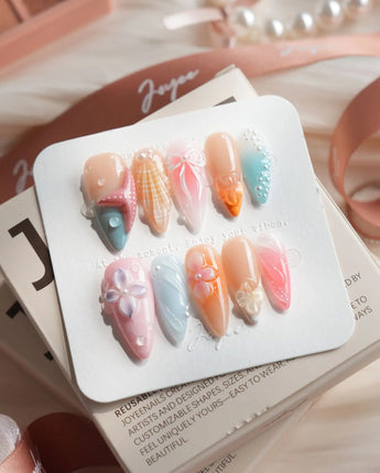 Candy Shore medium stiletto nails with pastel starfish and candy-colored shell art