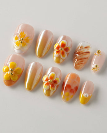 Caramel Bloom press-on nails in extra short almond with glossy caramel floral design