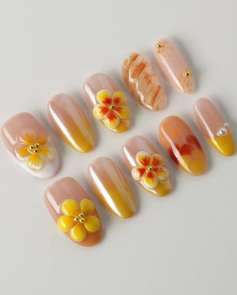 Caramel Bloom press-on nails in medium oval with warm caramel color and glossy florals
