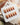 Caramel Chrome medium oval press-on nails with nude French tip styling with glossy gel finish