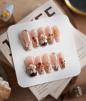 Caramel Cream press-on nails in medium coffin shape — Caramel Warm Brown Theme, 3D Flowers and Gold Wire accents.