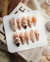 Caramel Cream in medium stiletto shape with caramel 3D flowers and gold wire accents