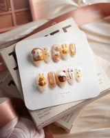 Caramel Miffy bunny dessert press-on nails in extra short almond shape