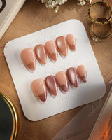 Caramel Petal press-on nails with warm rose chrome French tips and baroque gold detailing