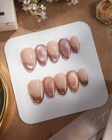 Caramel Petal press-on nails with rose chrome French styling and delicate gold baroque accents