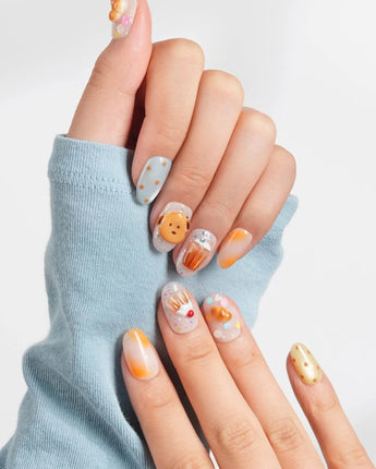 Caramel Toast custom press-on nails with warm bakery tones and ice cream cone accents