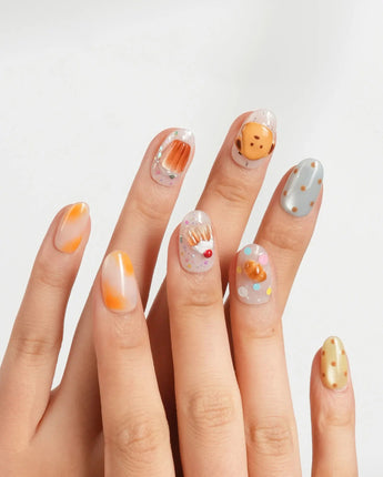 Caramel Toast handmade dessert nails with golden caramel drip and confetti dots