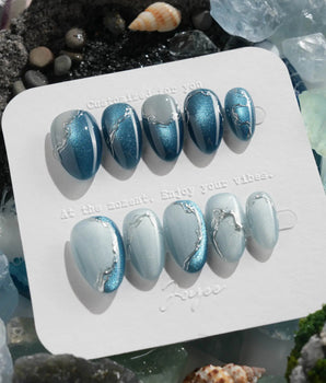 Banff Blue glacial lake nails with turquoise cat-eye shimmer and flowing silver lines