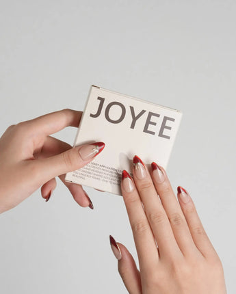 Bow French press-on nails with red chrome French design, gold trim and glossy nude base