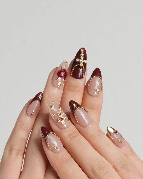 Celestial nails with star and cross embellishments