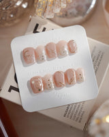 Champagne Nova nails in extra short coffin — Icy Nude Pink &