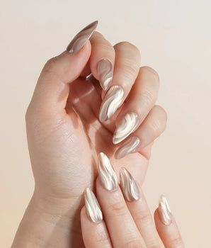 Champagne Ribbons nail art close-up showing Champagne Nude Gold, Silky Cat-eye Textures & Streamlined Wave Luster. details
