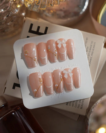 Champagne Veil nails in medium coffin — Soft Nude Pink, Shimmering