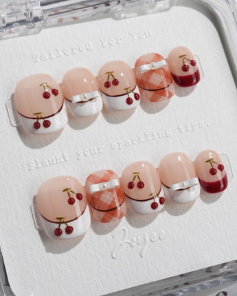 Cherry Miss press-on nails in extra short squoval shape — Red White French, 3D Bow & Cherry.