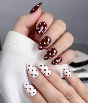 Choco Pop nail set with glossy wine red, cream white nails, and playful polka-dot accents
