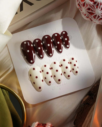 Choco Pop press-on nails featuring retro red-and-cream polka dots and glossy gel shine