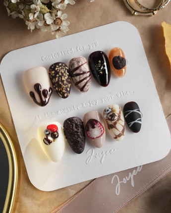 Chocolate Box press-on nails with glossy brown gel and dimensional dessert details