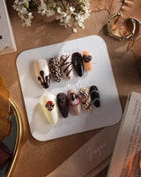 Chocolate Box press-on nails with realistic handmade chocolate pieces and 3D dessert nail art