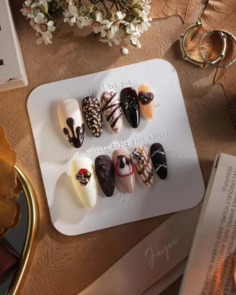 Chocolate Box press-on nails with realistic handmade chocolate pieces and 3D dessert nail art