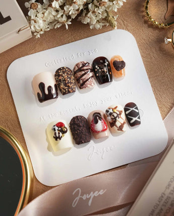Chocolate Box press-on nails with dessert box styling, raised chocolate pieces and glossy finish