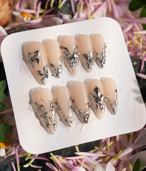 Chrome Rebellion press-on nail set — Nude, 3D Silver Butterflies & Liquid Metal. design, hand-painted with real gel polish