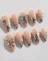 Chrome Rebellion press-on nails in short almond shape — Nude, 3D Silver Butterflies & Liquid Metal.