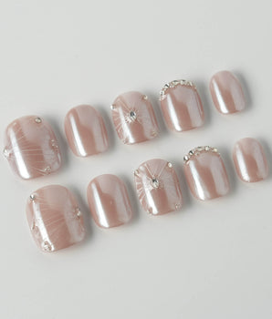 Chrome Wings press-on nails in extra short squoval shape — chrome Icy Pink, Sparkling Rhinestone Fireworks.