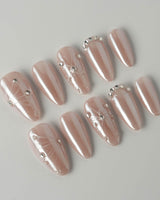 Chrome Wings press-on nails in medium almond shape — chrome Icy Pink, Sparkling Rhinestone Fireworks.