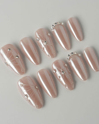 Chrome Wings press-on nails in medium almond shape — chrome Icy Pink, Sparkling Rhinestone Fireworks.