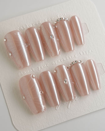 Chrome Wings press-on nails in medium coffin shape — chrome Icy Pink, Sparkling Rhinestone Fireworks.