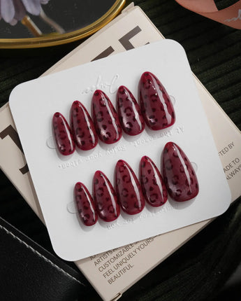 Claret leopard cat eye press on nails, deep wine red base with a rose gold shimmer band and hand-painted black leopard spots - image 2