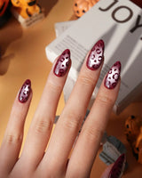 Claret leopard cat eye press on nails, deep wine red base with a rose gold shimmer band and hand-painted black leopard spots - image 3