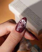 Claret leopard cat eye press on nails, deep wine red base with a rose gold shimmer band and hand-painted black leopard spots - image 4