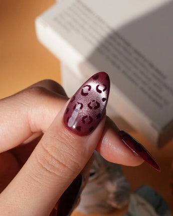 Claret leopard cat eye press on nails, deep wine red base with a rose gold shimmer band and hand-painted black leopard spots - image 4