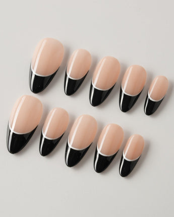 Classic Return - Ebony in medium almond shape with black French tips and white line art