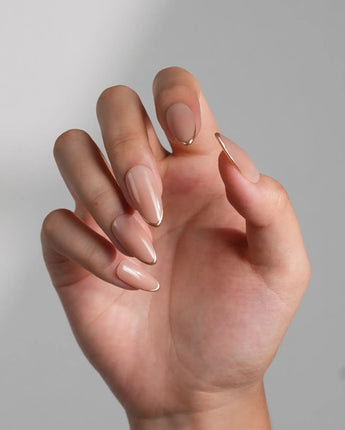 Clean Grace nail art close-up showing gold french tip nails details