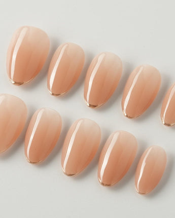 Clean Grace press-on nails in extra short almond shape — gold french tip nails
