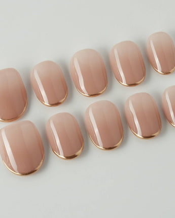 Clean Grace press-on nails in extra short oval shape — gold french tip nails