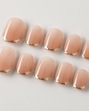 Clean Grace press-on nails in extra short squoval shape — gold french tip nails