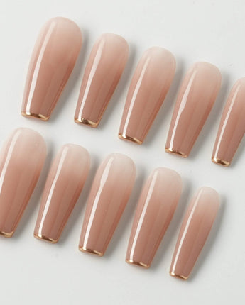 Clean Grace press-on nails in long coffin shape — gold french tip nails