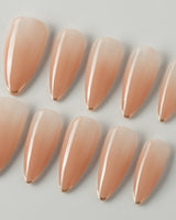 Clean Grace press-on nails in medium stiletto shape — gold french tip nails